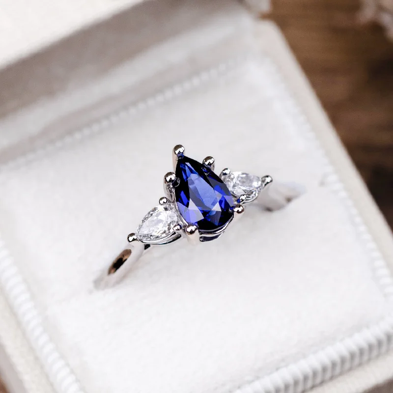 The Diana - Blue Sapphire Pear Cut Three Stone Engagement Ring with Diamond Accents